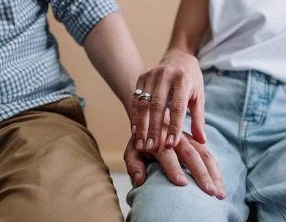 Picture of a couple touching hands