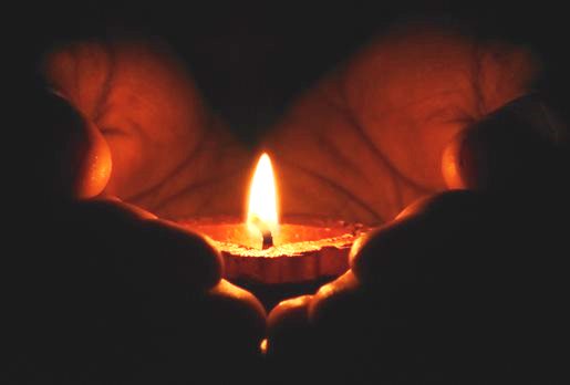 Picture of hands cradling a candle